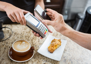 Person paying with mobile phone